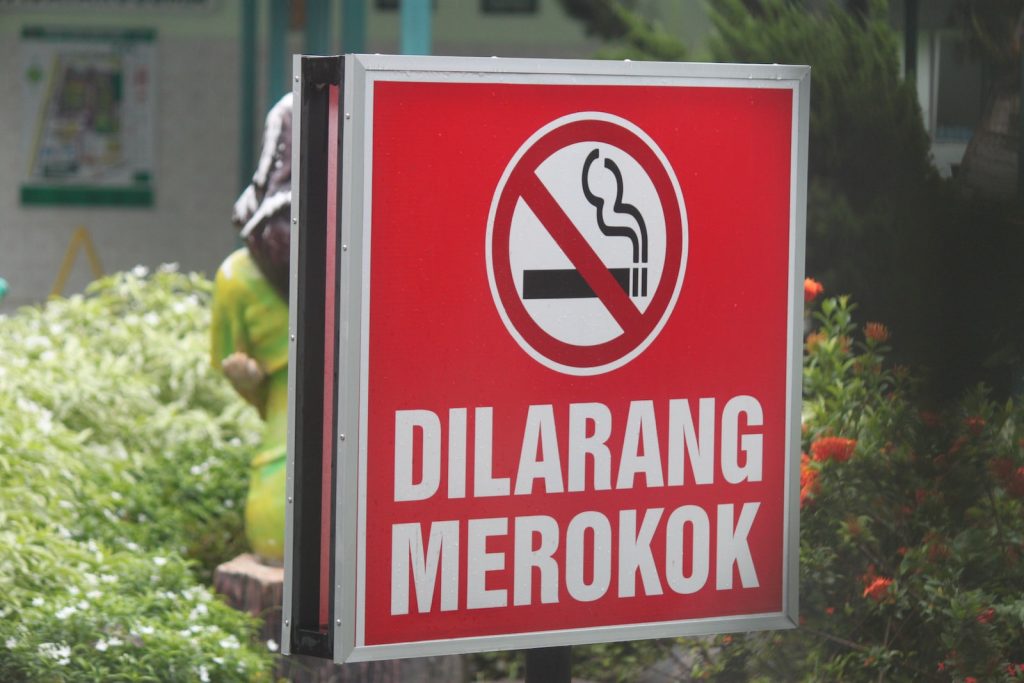 red and white no smoking sign